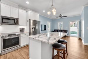 Real estate Airbnb photography of interior kitchen area in Loganville, Georgia. Gwinnett County